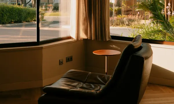 Comfortable therapy chair in a warm, quiet room