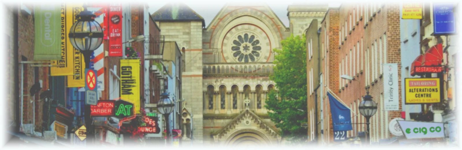 People walking on Grafton Street near Saint Ann's Church in Dublin